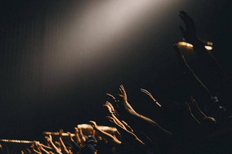 hands lifted up in prayer and worship