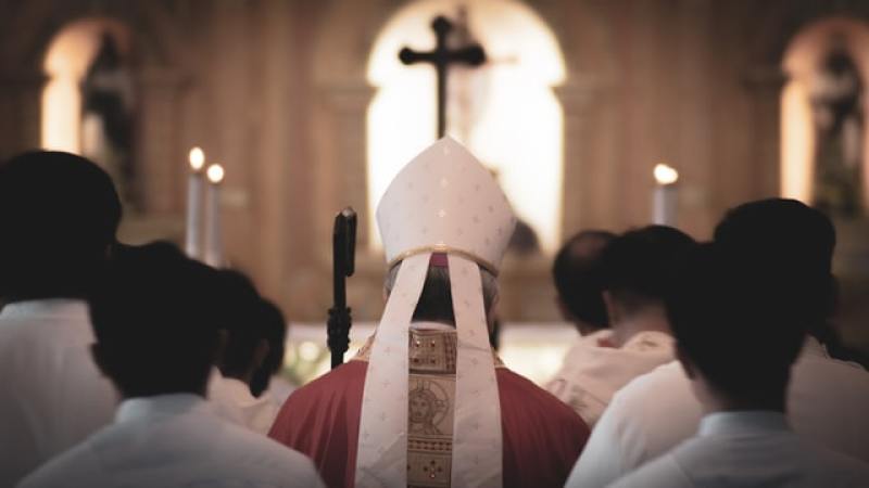 Catholic priest proceeding to the altar