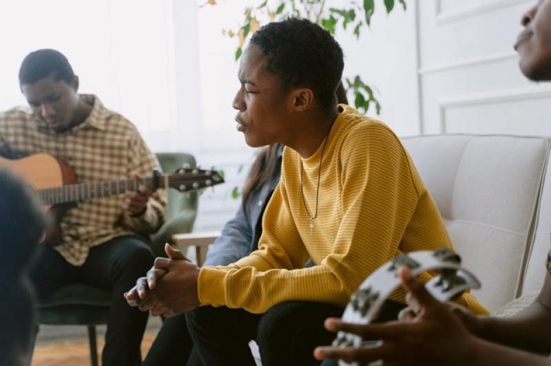 A group of people singing in worship
