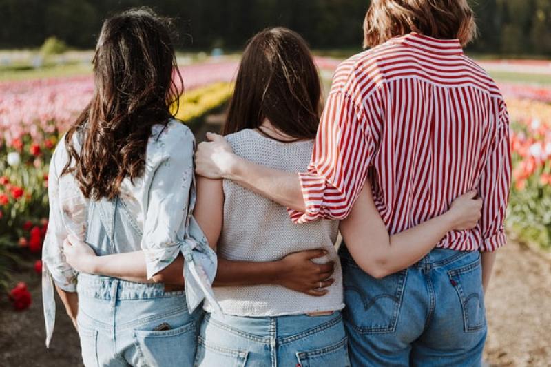 three women beside one another