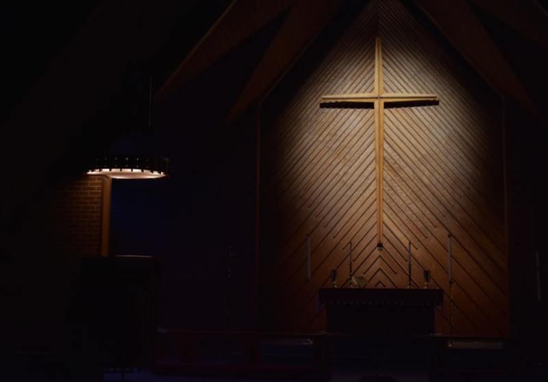 cross behind stage