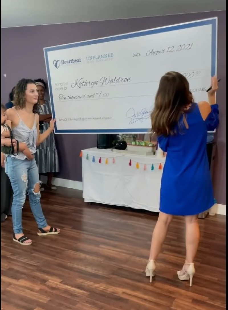 Ashley Bratcher awarding single mom Katy with the Unplanned Movie Scholarship grant
