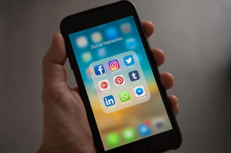 smartphone with logos of social media apps