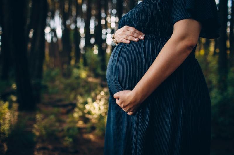 pregnant mom with her growing baby inside the womb